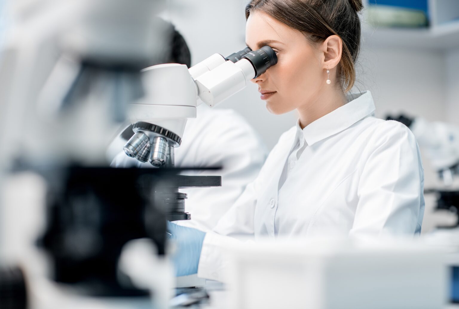 Doctor at microscope