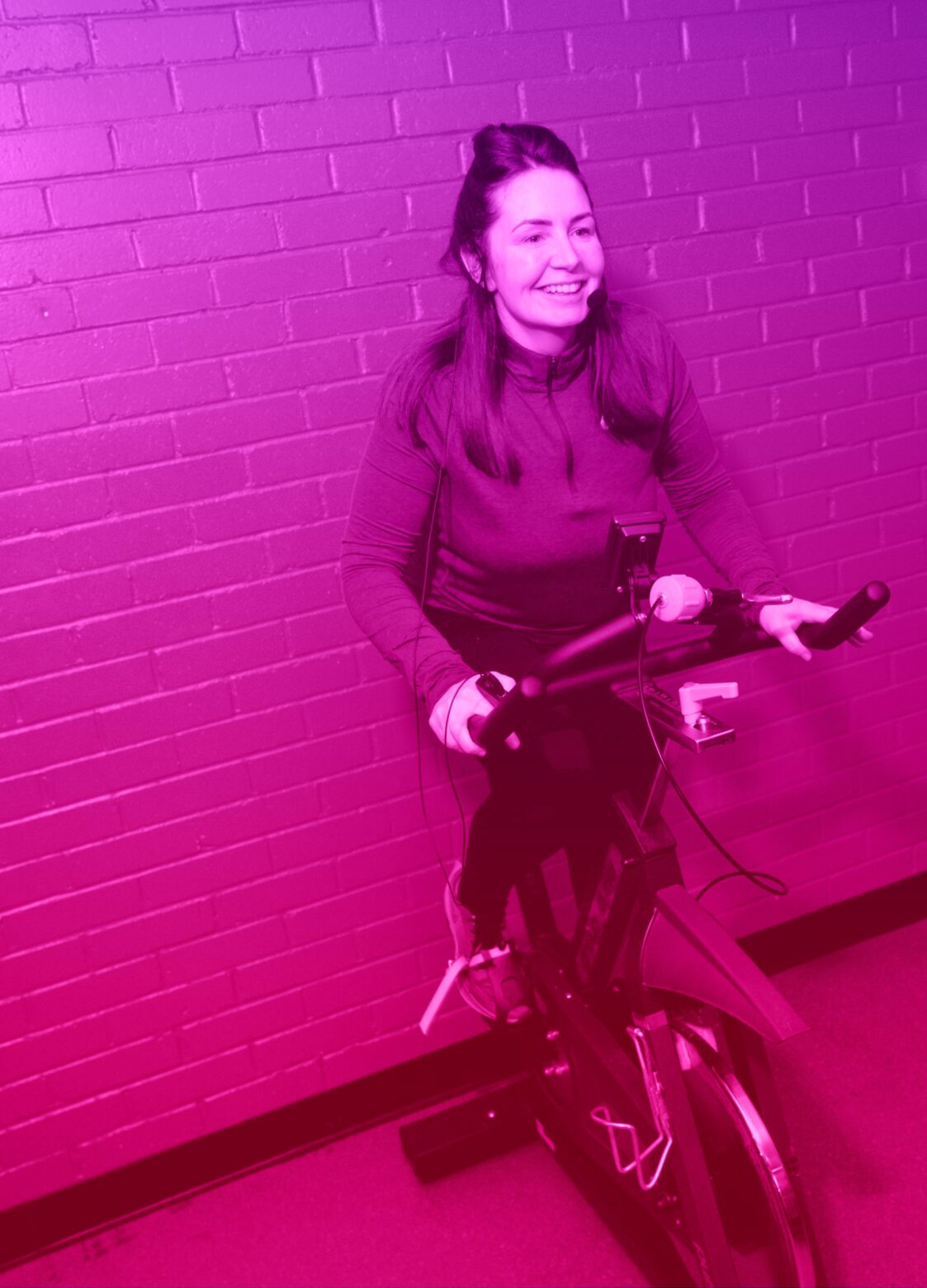 Person using exercise bike at Enjoy East Ren leisure facility in East Renfrewshire
